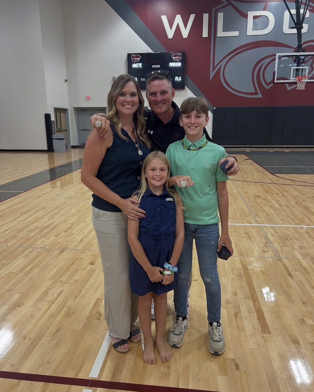 Coach Morris and family with championship rings