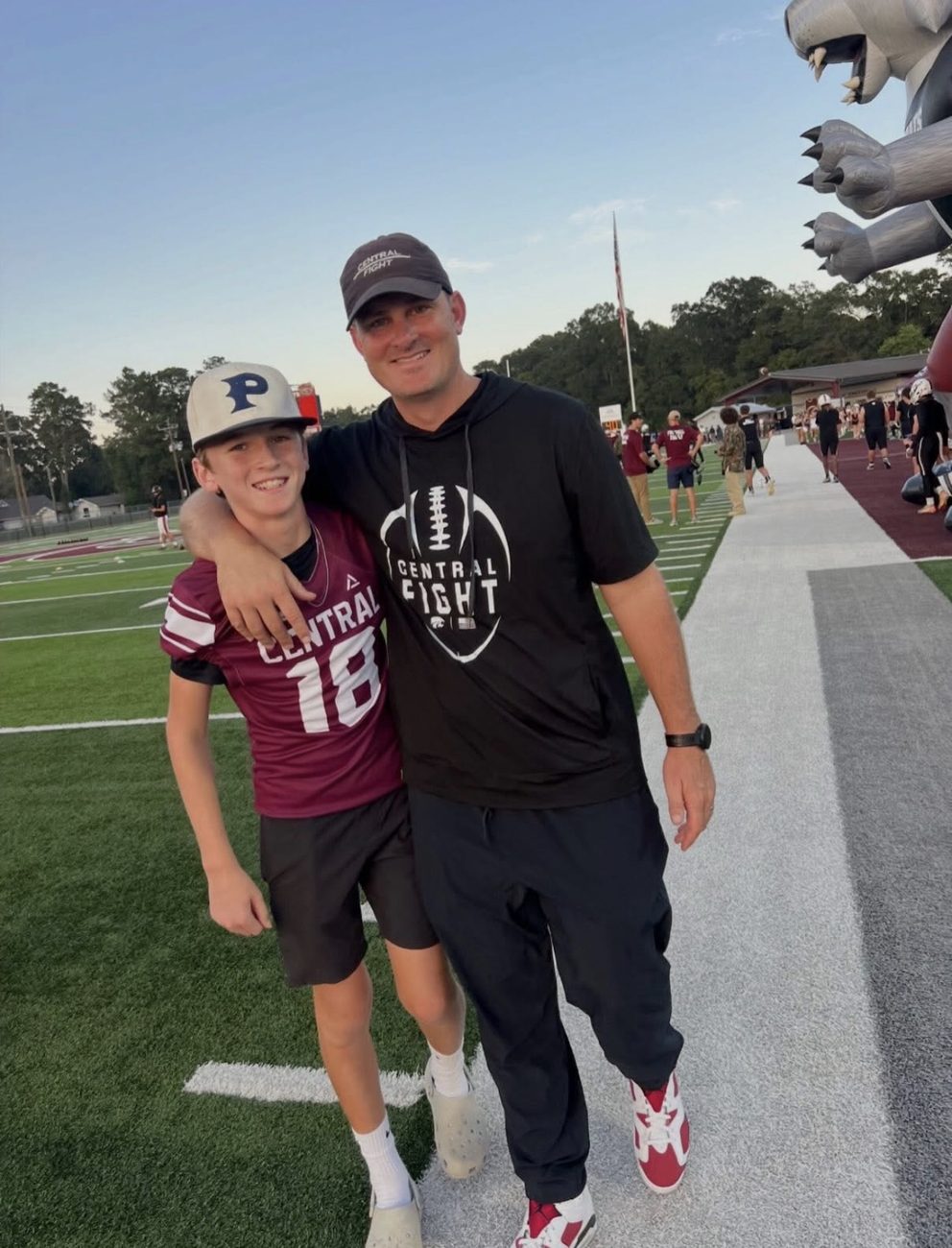Coach Morris with his son on the field