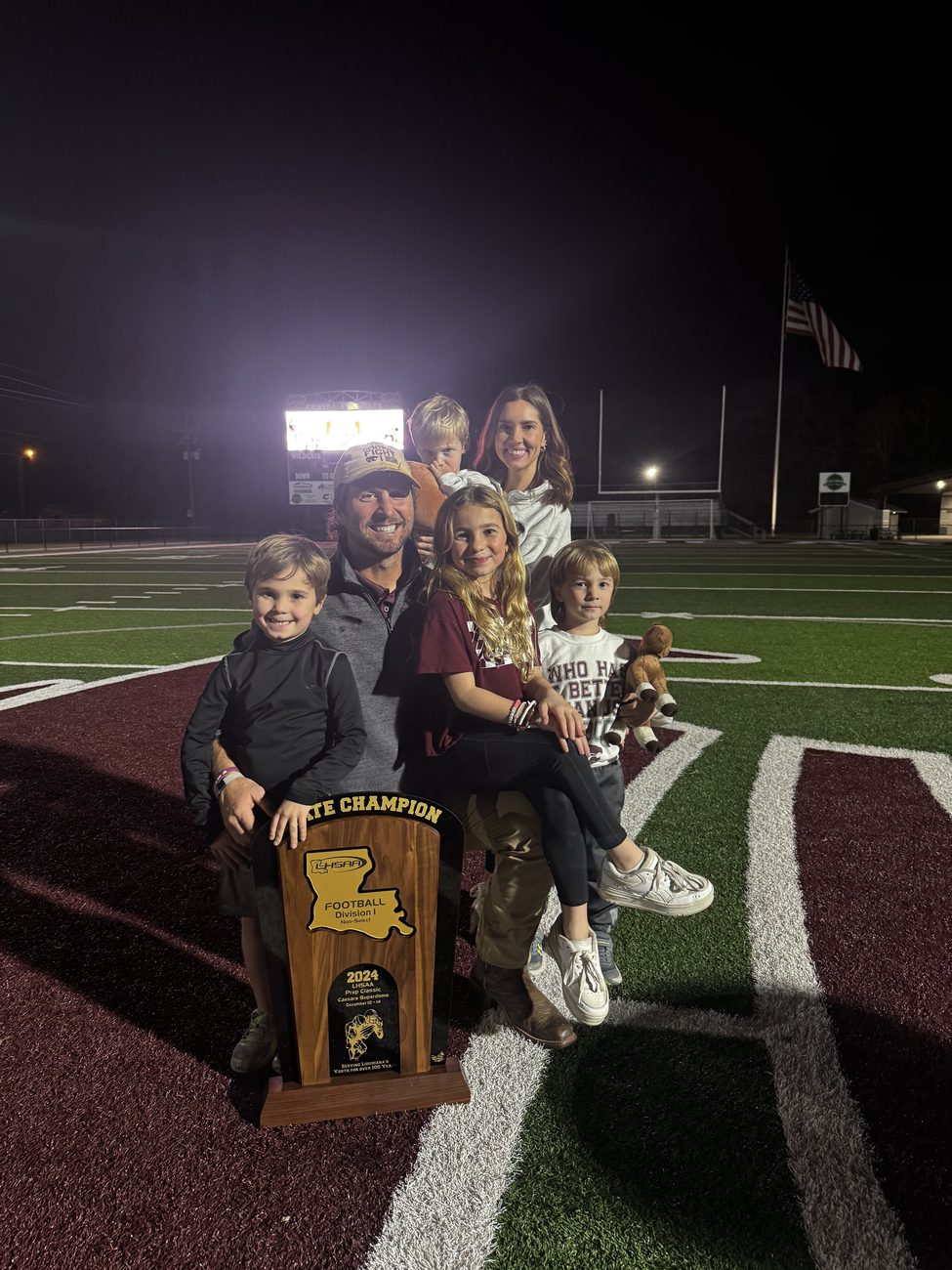 Coach Simoneaux and family with the 2024 State Champion trophy
